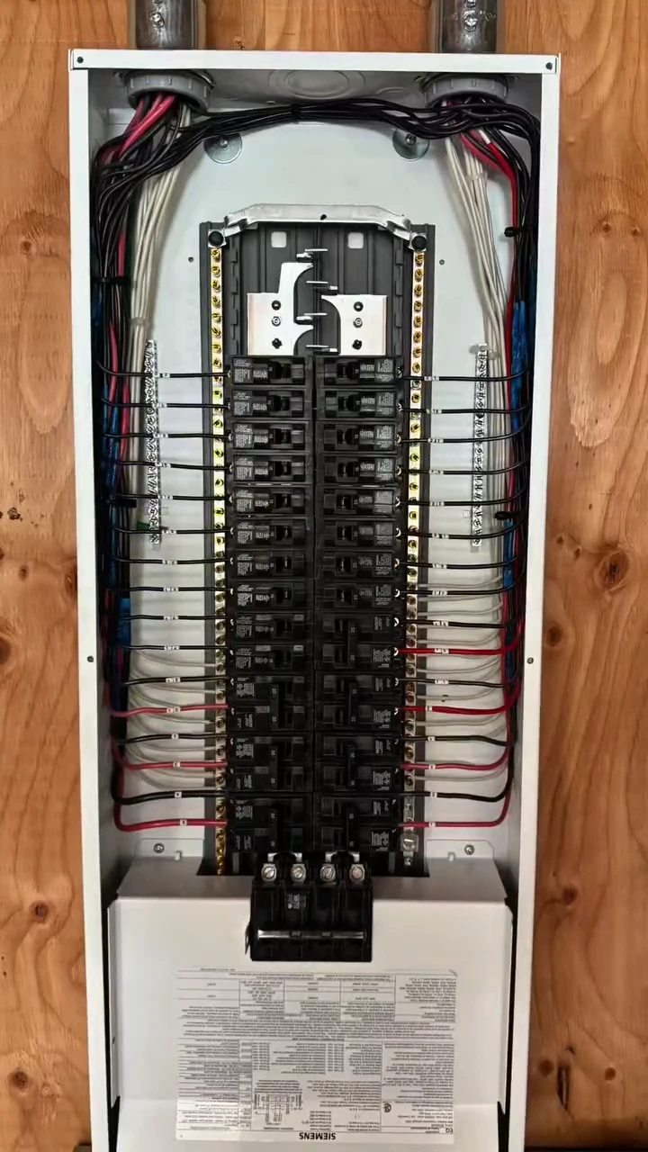 An open electrical panel in a Langley home with neatly dressed branch circuits landed on the breakers and a tidy neutral bar.